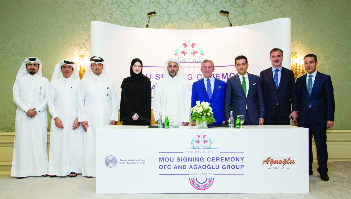 Yousuf Mohamed Al Jaida (centre), Chief Executive Officer, QFC; Sheikha Alanoud Hamad Al Thani (fourth left), Managing Director, Business Development, QFC; Ali ?brahima?ao?lu (fourth right), Chairman, A?ao?lu Group; Mehmet Burak Kutlu? (third right), Exec